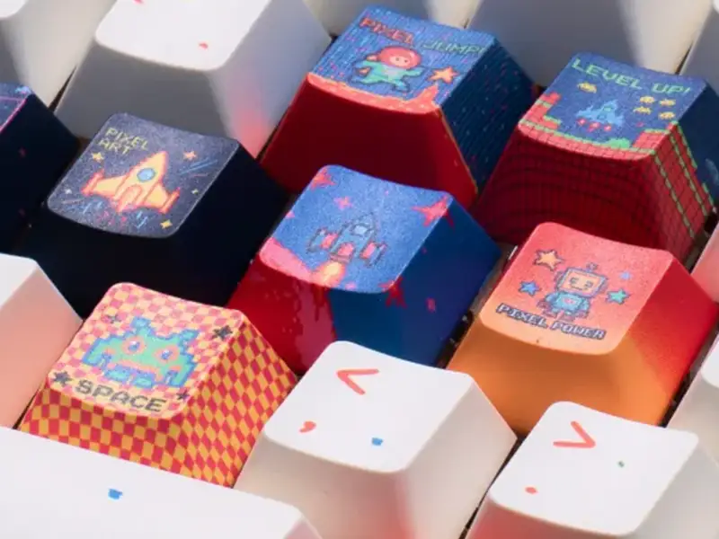 Mit dem Vakuum-Modul kann die WonderPress auch 3D-Objekte wie Keycaps mühelos rundum sublimieren.